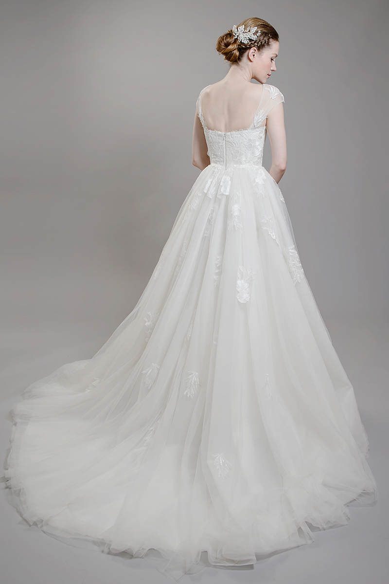Semi-sweetheart neckline can be changed to sweetheart by request. Hidden zipper closure and a chapel train. MSRP $1008