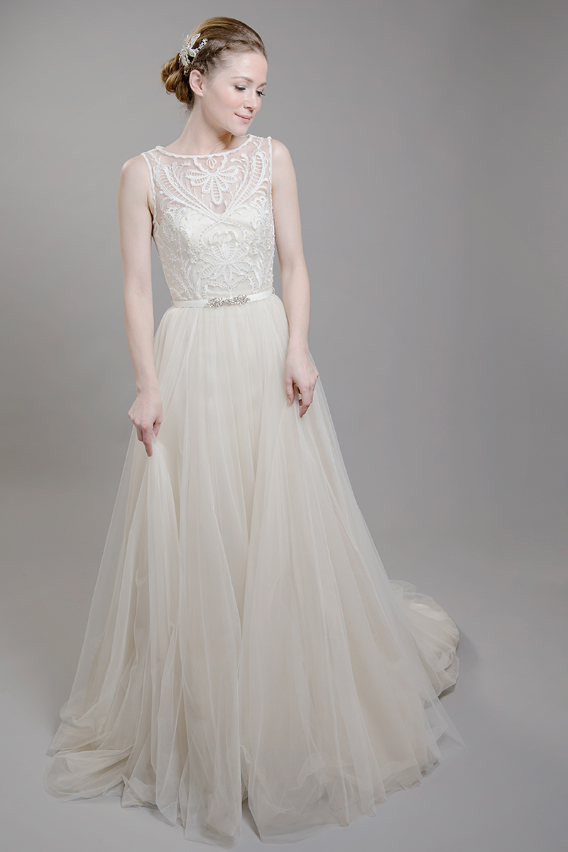 The soft tulle of F1610 is offset with lovely embroidery beaded with pearl. It features a beautiful statement illusion neckline, and has a handmade, detachable belt with crystal beading.
