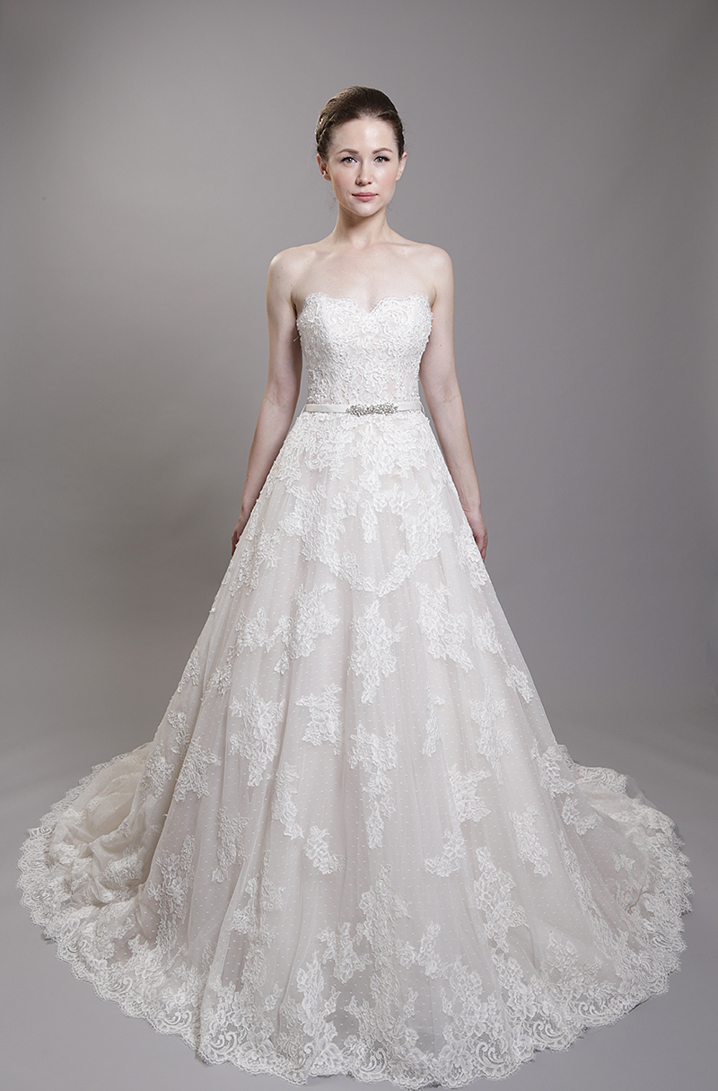 The depth of the pattern on F1621 isn't immediately visible. The tiny dots on the top layer of tulle add depth and beauty to the sweetheart neckline. The beaded lace is enhanced by a handmade, detachable crystal-beaded belt.